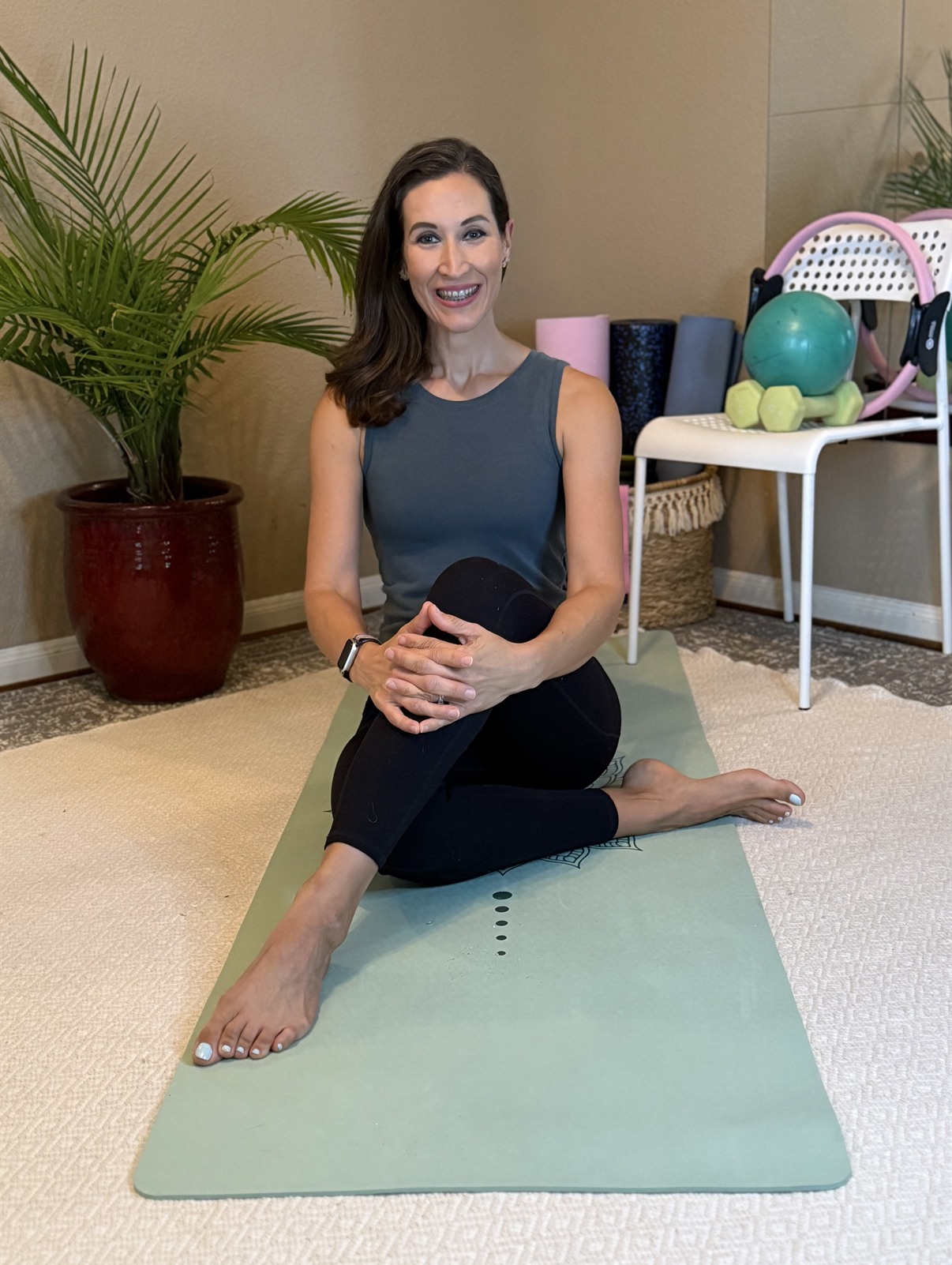 Ana Ruhge practicing Pilates at a barre